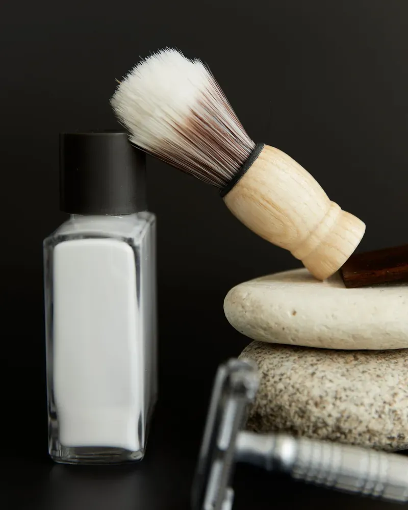 Shaving brush, razor and grooming bottle