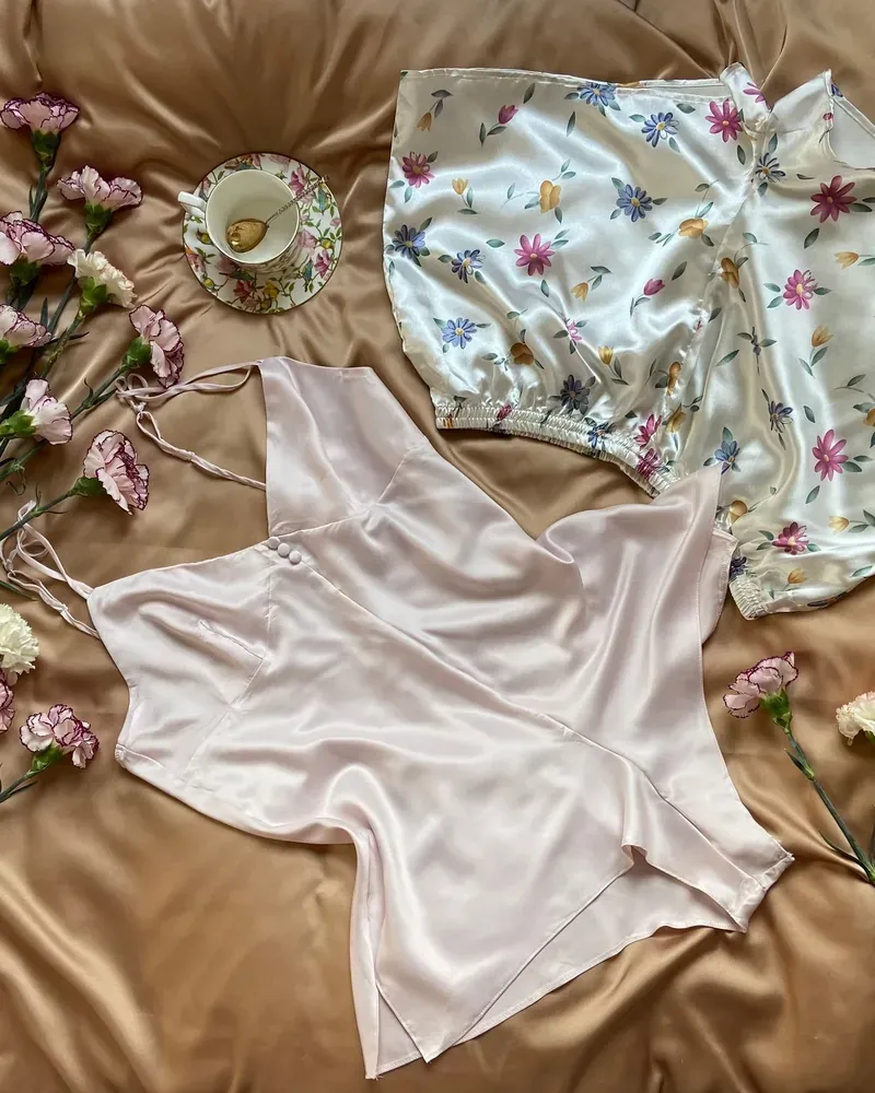 Silk nightwear laid out with flowers